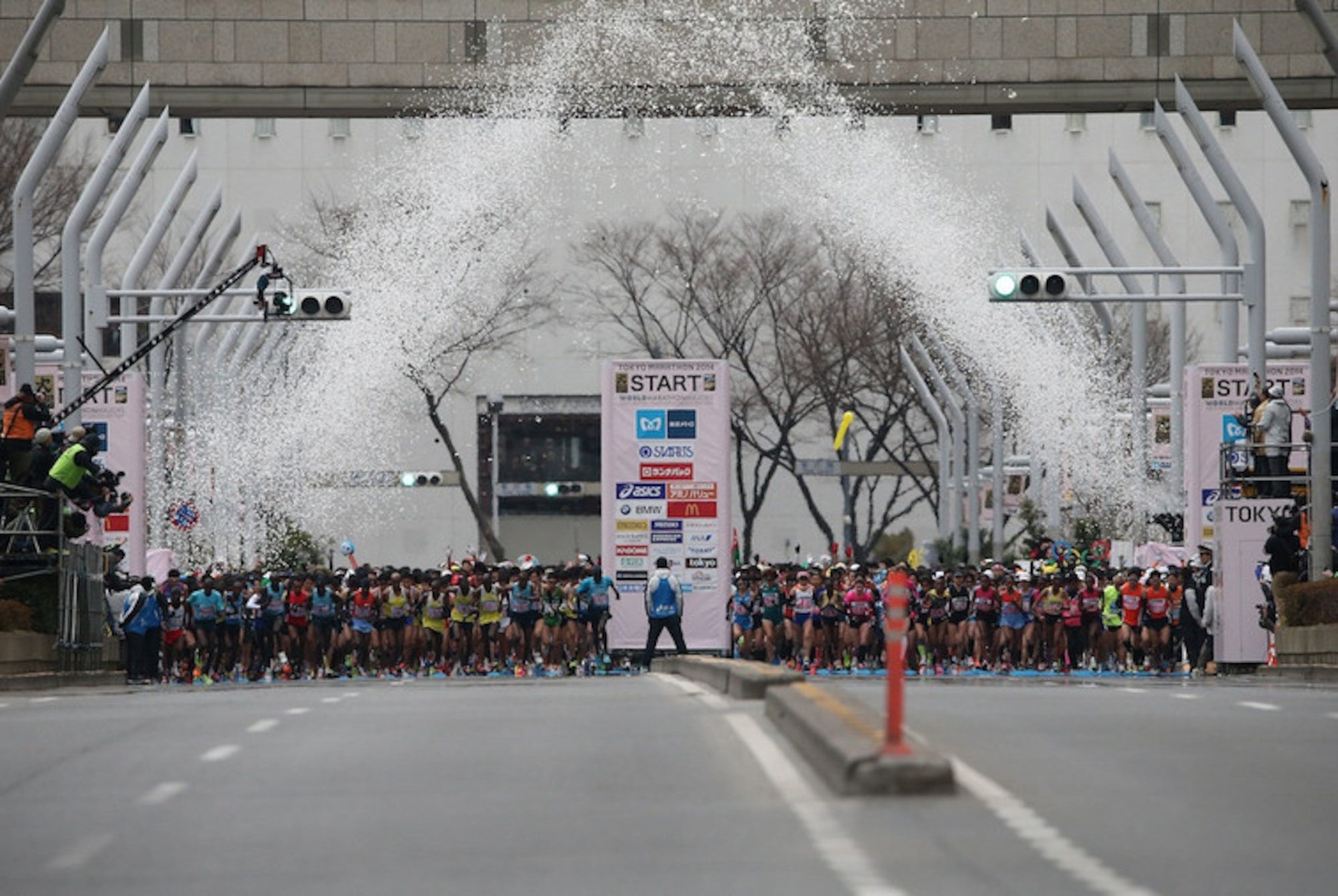 Cannons shoot confetti into the air marking the start of the 2015 Tokyo Marathon, in Tokyo, Japan, Feb. 22, 2015.  The race is one of six World Marathon Majors, and hosted about 35,000 world runners and included 586 American participants, six of whom were members of the Misawa Flyers from Misawa Air Base, Japan. (Courtesy Photo)