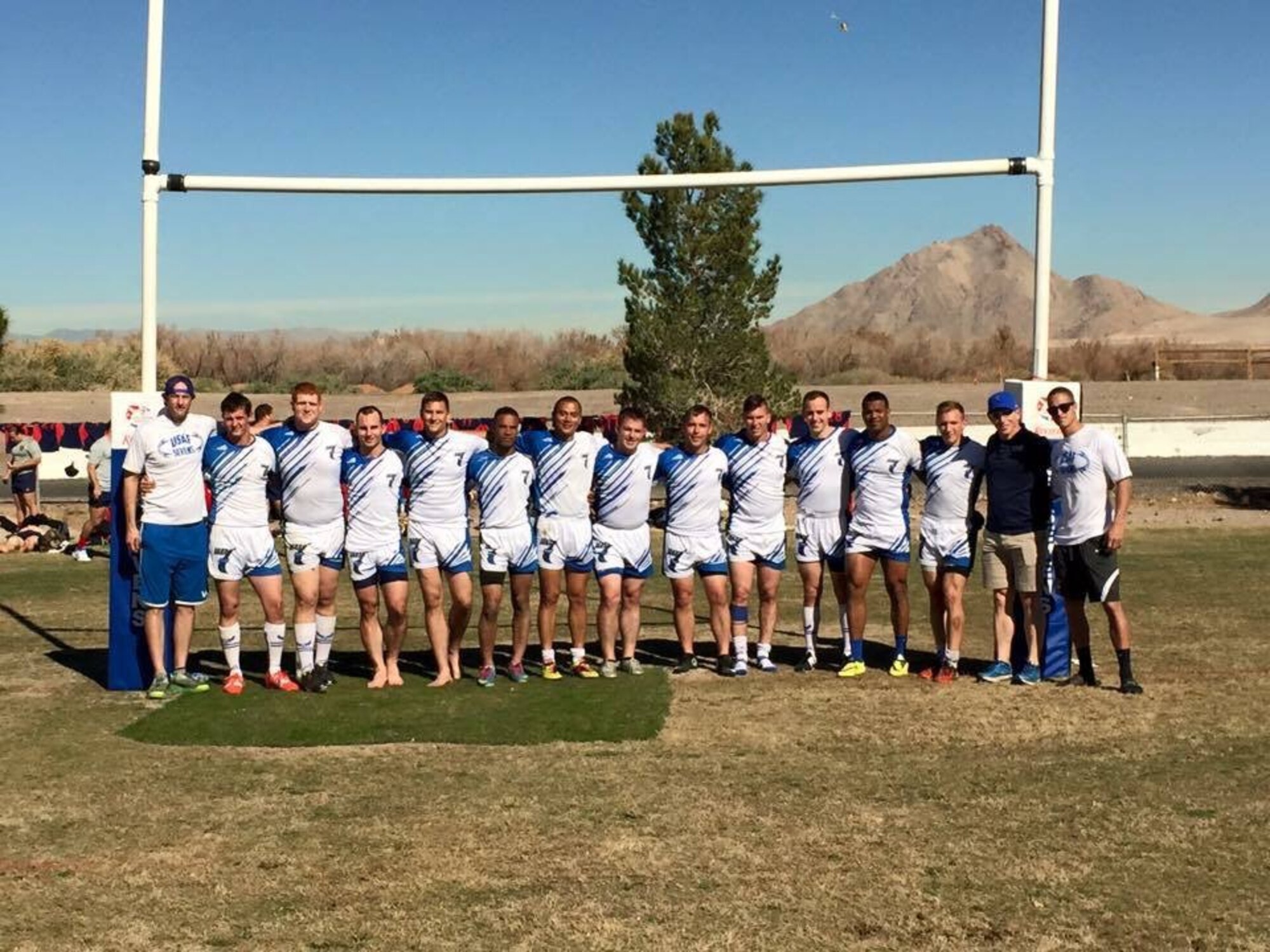 2nd Lt. James MacAndrew, 2nd Space Warning Squadron mission crew commander, far right, and Senior Airman Theodore Szarzynski, 233rd Space Group systems administrator, seventh from right, pose with the rest of the Air Force Aces rugby team during the Las Vegas Invitational rugby tournament. (courtesy photo)