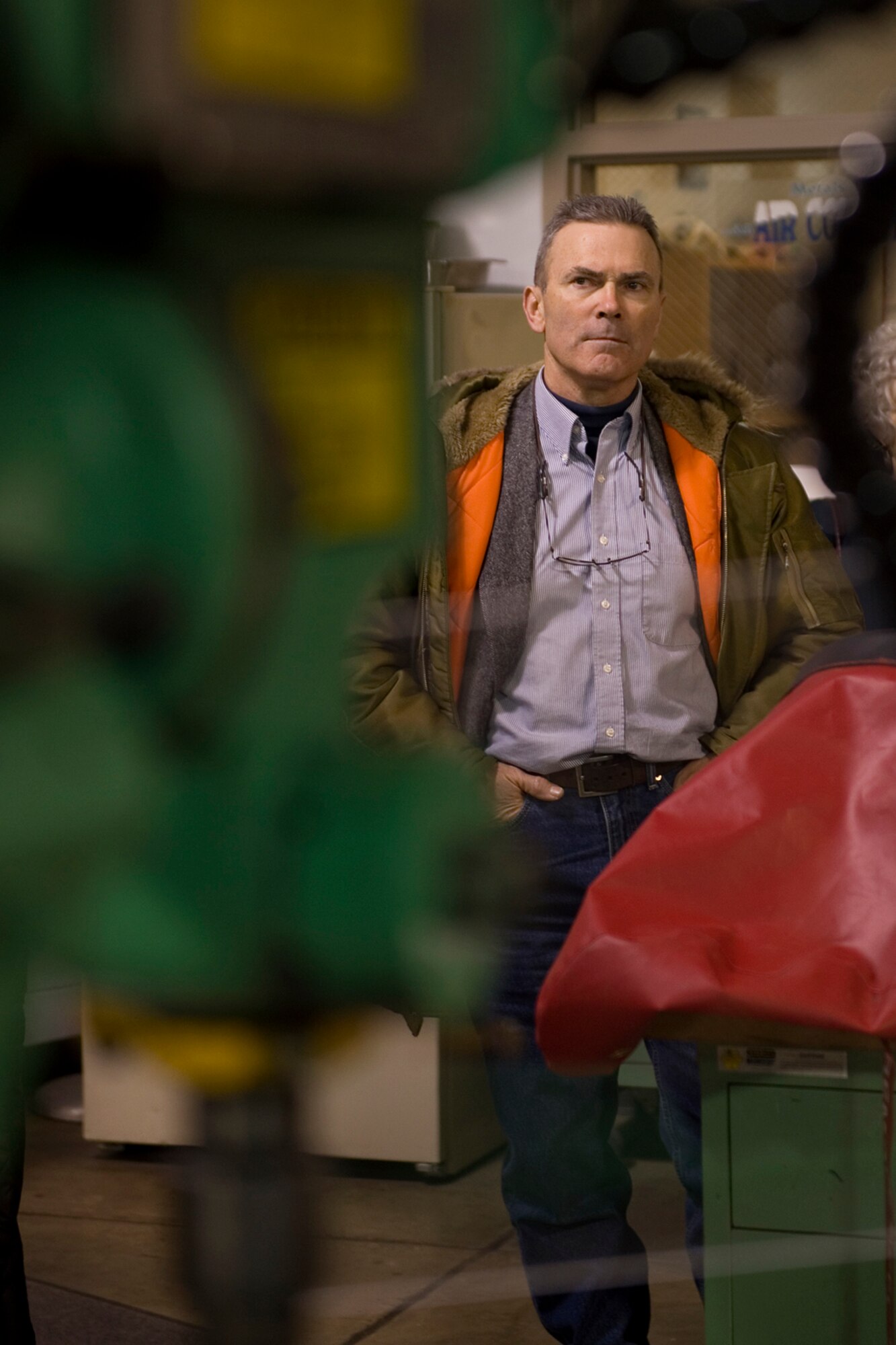 Retired Col. Tim Cahoon, Grissom Community Council member, observes a drill press used by 434th Aircraft Maintenance Squadron fabrication flight during a tour at Grissom Air Reserve Base, Ind., Feb. 13, 2015. The 434th Aircraft Maintenance Squadron fabrication flight manufactures and repairs all aircraft parts that cannot be procured through a supply source. (U.S. Air Force photo/Tech. Sgt. Benjamin Mota)