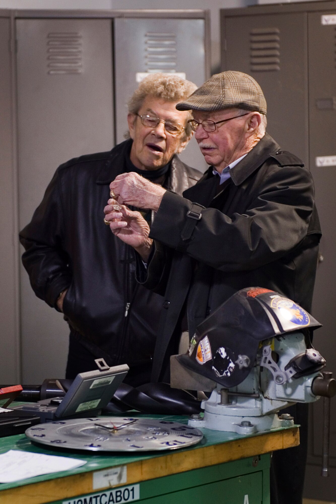 David Shearer, Grissom Community Council Kokomo regional director, and Phil Lake, GCC member, get a close-up view of small drill bits used by the 434th Aircraft Maintenance Squadron fabrication flight during a tour at Grissom Air Reserve Base, Ind., Feb. 13, 2015. The 434th Aircraft Maintenance Squadron fabrication flight manufactures and repairs all aircraft parts that cannot be procured through a supply source. (U.S. Air Force photo/Tech. Sgt. Benjamin Mota)