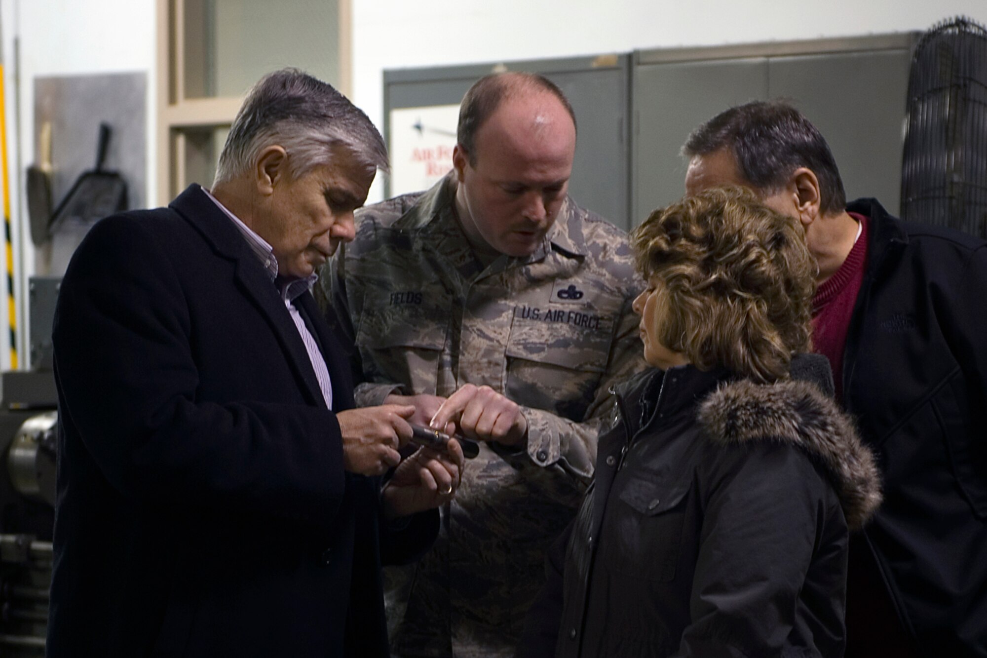 Master Sgt. Corey Fields, 434th Maintenance Squadron structural maintenance supervisor, describes the machining process used to fabricate components of a KC-135R Stratotanker to a group of Grissom Community Council members during a tour at Grissom Air Reserve Base, Ind., Feb. 13, 2015. The 434th Aircraft Maintenance Squadron fabrication flight manufactures and repairs all aircraft parts that cannot be procured through a supply source. (U.S. Air Force photo/Tech. Sgt. Benjamin Mota)