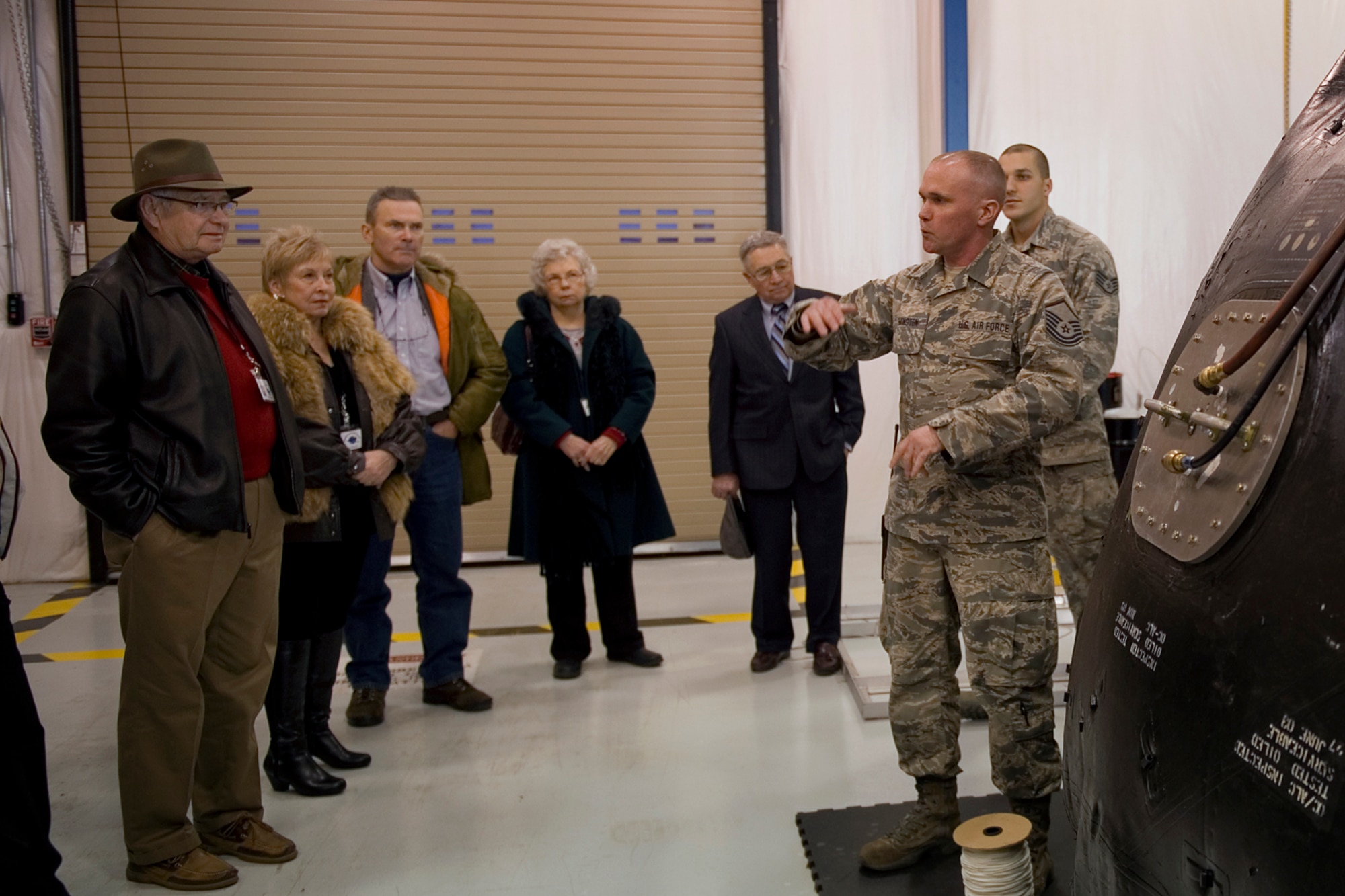 Master Sgt. Brian Remington, 434th Maintenance Squadron fuel system technician, explains the functions of a fuel-cell bladder to a group of Grissom Community Council members during a tour at Grissom Air Reserve Base, Ind., Feb. 13, 2015. The tour was part of a State of Base address hosted by Grissom for elected officials and civic leaders. (U.S. Air Force photo/Tech. Sgt. Benjamin Mota)