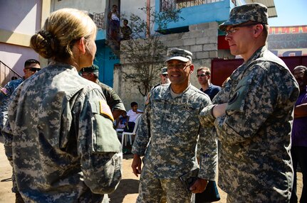 U.S. Army Capt. Maria Forstner, Joint Task Force-Bravo Medical Element officer in charge of the mobile surgical team, briefs U.S. Army Col. Carlos Figueroa, U.S. Embassy Guatemala Military Group Commander, and U.S. Army Col David Wolken, JTF-Bravo Medical Element Commander, on the Medical Readiness Training Exercise in La Blanca, Guatemala, Feb. 26, 2015.  Together JTF-Bravo, the Guatemalan Ministry of Health and members of the Guatemalan military came together to help provide medical care to over 1,200 Guatemalan citizens in need. During the two-day exercise, the JTF-Bravo team and preventative medicine specialists from the Guatemalan Ministry of Health educated, screened and treated over 1,200 patients. (U.S. Air Force Photo/Tech. Sgt. Heather Redman)