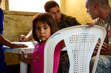A young girl goes through medical prescreening during a Medical Readiness Training Exercise in La Blanca, Guatemala, Feb. 26, 2015.  Together JTF-Bravo, the Guatemalan Ministry of Health and members of the Guatemalan military came together to help provide medical care to over 1,200 Guatemalan citizens in need. During the two-day exercise, the JTF-Bravo team and preventative medicine specialists from the Guatemalan Ministry of Health educated, screened and treated over 1,200 patients. (U.S. Air Force Photo/Tech. Sgt. Heather Redman)
