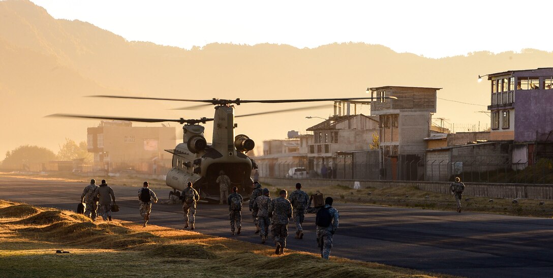 A Chinook helicopter assigned to the 1st Brigade 228th Aviation Regiment waits on the runway at the Guatemalan 12th Mountain Brigade to load personnel heading for a Medical Readiness Training Exercise in La Blanca, Guatemala, Feb. 26, 2015. During the two-day exercise, the JTF-Bravo team and preventative medicine specialists from the Guatemalan Ministry of Health educated, screened and treated over 1,200 patients. (U.S. Air Force Photo/Tech. Sgt. Heather Redman)
