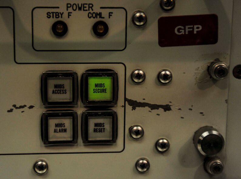 Buttons line the rapid execution and combat targeting console in the launch capsule of the Oscar 1 missile alert facility near Mohall, N.D., Jan. 9, 2015. Capsule crews control the missile from the REACT console through an array of coded commands, keys and switches. (U.S. Air Force photo/Senior Airman Stephanie Morris)