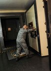 Master Sgt. John Stinson, 742nd Missile Squadron facility manager, opens a blast door in the Oscar 1 missile alert facility near Mohall, N.D., Jan. 9, 2015. As facility manager Stinson is responsible for the overall upkeep of the structures at Oscar 1 as well as overseeing the water, heat and other utilities. (U.S. Air Force photo/Senior Airman Stephanie Morris)
