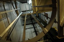 An escape ladder connects the underground portion of the Oscar 1 missile alert facility to the surface level near Mohall, N.D., Jan. 9, 2015. The ladder is located near an elevator which connects the structure’s top side to the capsule below ground where the launch control officers work. (U.S. Air Force photo/Senior Airman Stephanie Morris)