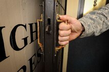 Master Sgt. John Stinson, 742nd Missile Squadron facility manager, closes the door of the elevator in the Oscar 1 missile alert facility near Mohall, N.D., Jan. 9, 2015. The elevator connects the structure’s top side to the capsule below ground where the launch control officers work. (U.S. Air Force photo/Senior Airman Stephanie Morris)