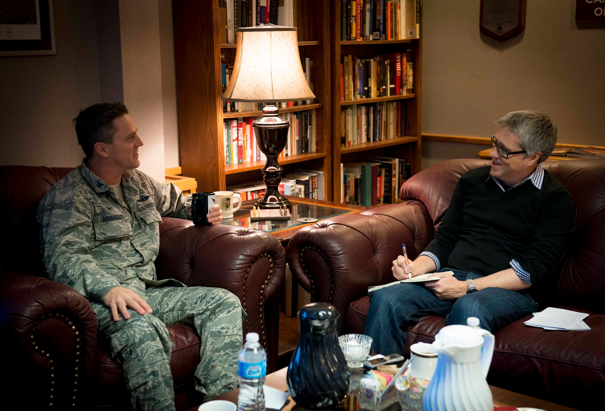 David Taylor, Times of London editor, interviews Col. Jason Armagost, 5th Bomb Wing commander, on Minot Air Force Base, N.D., Jan. 7, 2014. Armagost spoke about the great sense of community the base has, along with the many opportunities for education provided for Airmen. (U.S. Air Force photo/Airman 1st Class Sahara L. Fales)