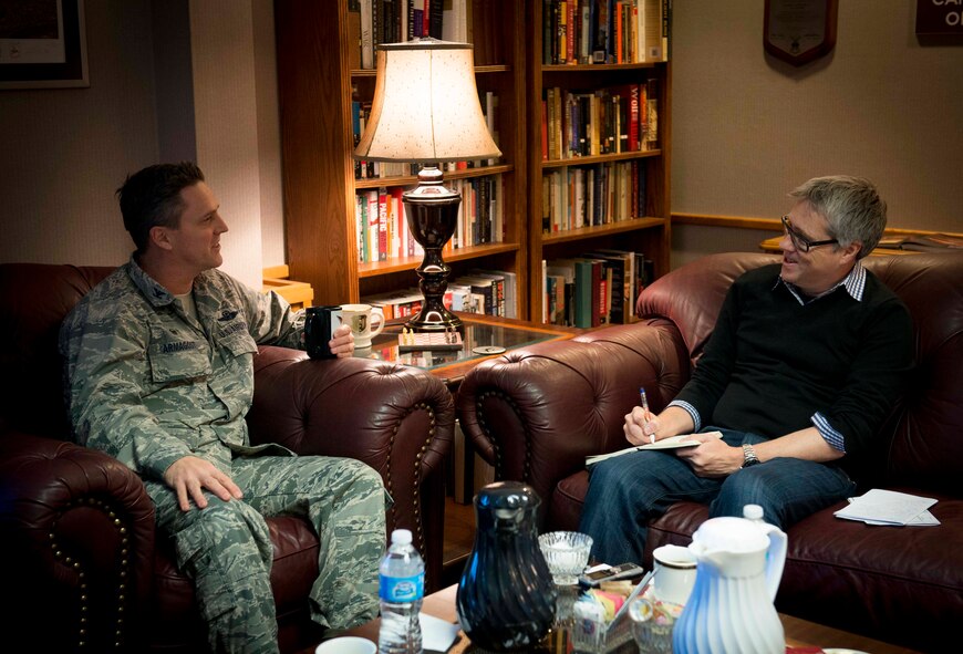 David Taylor, Times of London editor, interviews Col. Jason Armagost, 5th Bomb Wing commander, on Minot Air Force Base, N.D., Jan. 7, 2014. Armagost spoke about the great sense of community the base has, along with the many opportunities for education provided for Airmen. (U.S. Air Force photo/Airman 1st Class Sahara L. Fales)