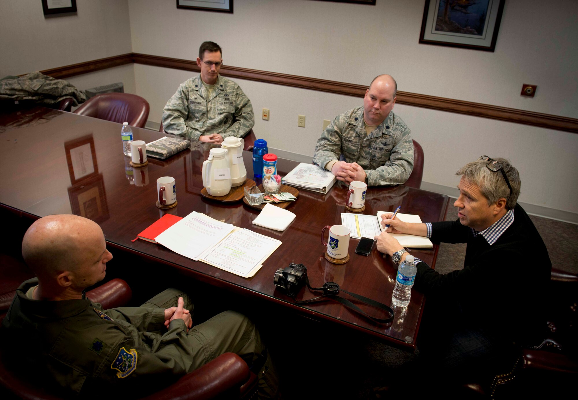 David Taylor, Times of London editor, speaks to 91st Missile Wing leadership on Minot Air Force Base, N.D., Jan. 7, 2014. During the conference, leadership informed Taylor of what to expect while visiting the missile alert facility. (U.S. Air Force photo/Airman 1st Class Sahara L. Fales)