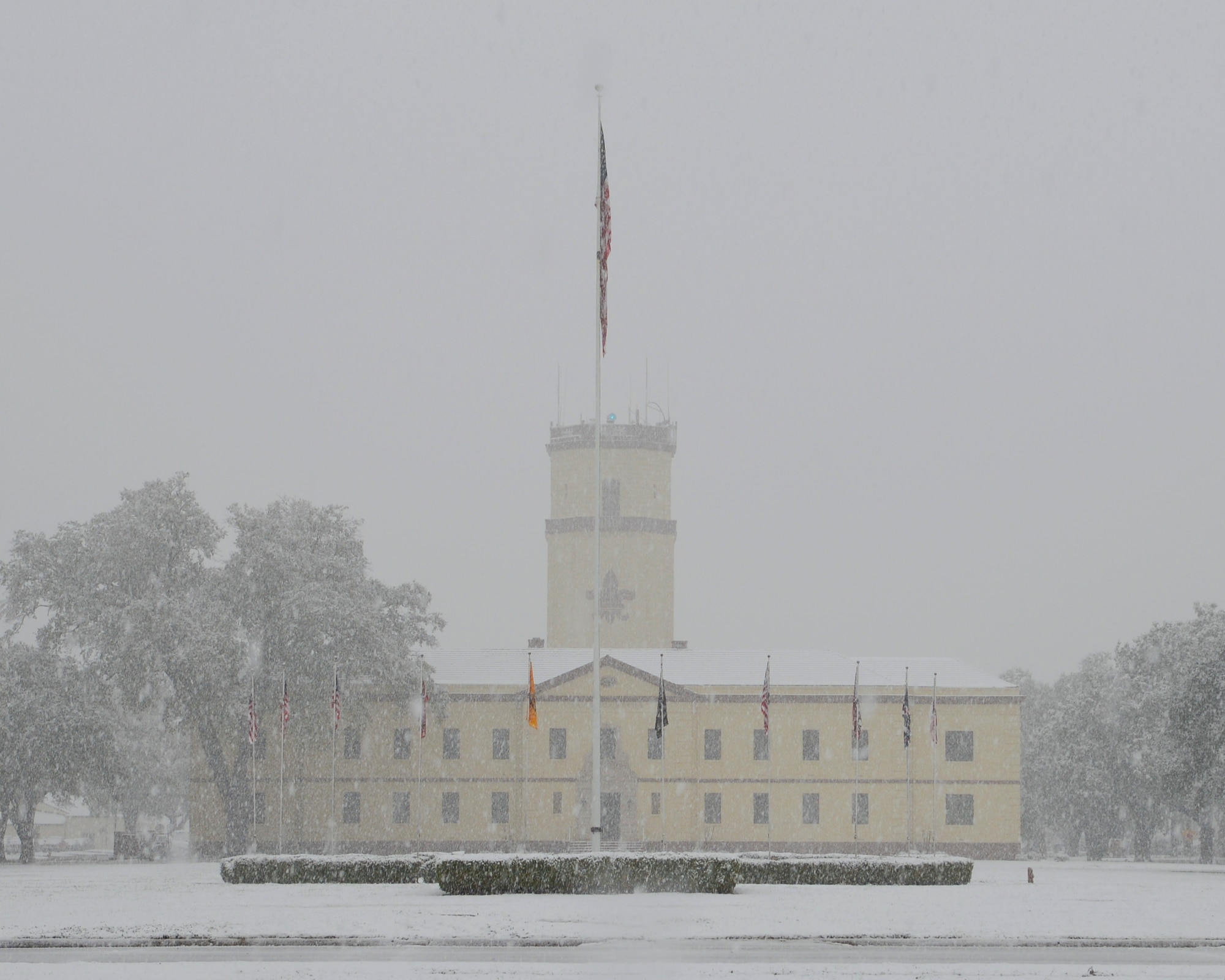 The 2nd Bomb Wing headquarters building is laden with snow after a winter storm on Barksdale Air Force Base, La., Feb. 25, 2015.  The base, which averages only one day of snow and 1.4 inches of total snowfall per year, was hit with 2.25 inches Feb. 25. (U.S. Air Force photo/Senior Airman Benjamin Raughton)