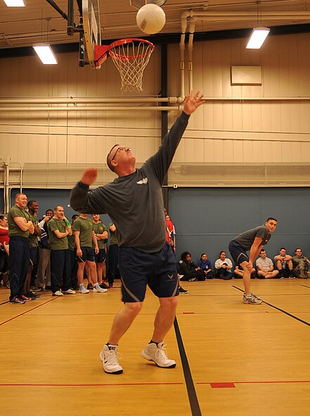 Chief Master Sgt. David Duncan, 319th Air Base Wing command chief, prepares to serve during the 319th ABW Wing Staff Agencies volleyball game against the 69th Reconnaissance Group Feb. 26, 2015 on Grand Forks Air Force Base, N.D. The 319th WSA lost to 69th RG by seven points, 25-18. (U.S. Air Force photo/Airman 1st Class Bonnie Grantham)