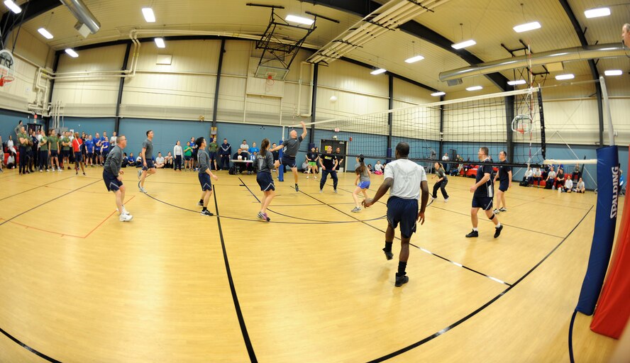 The 319th Wing Staff Agencies and 69th Reconnaissance Group volleyball teams face off during the 2015 Winter Bash on Grand Forks Air Force Base, N.D., Feb. 26. The 69th RG earned the first place trophy for that day’s volleyball event. (U.S. Air Force photo/Senior Airman Zachiah Roberson)
