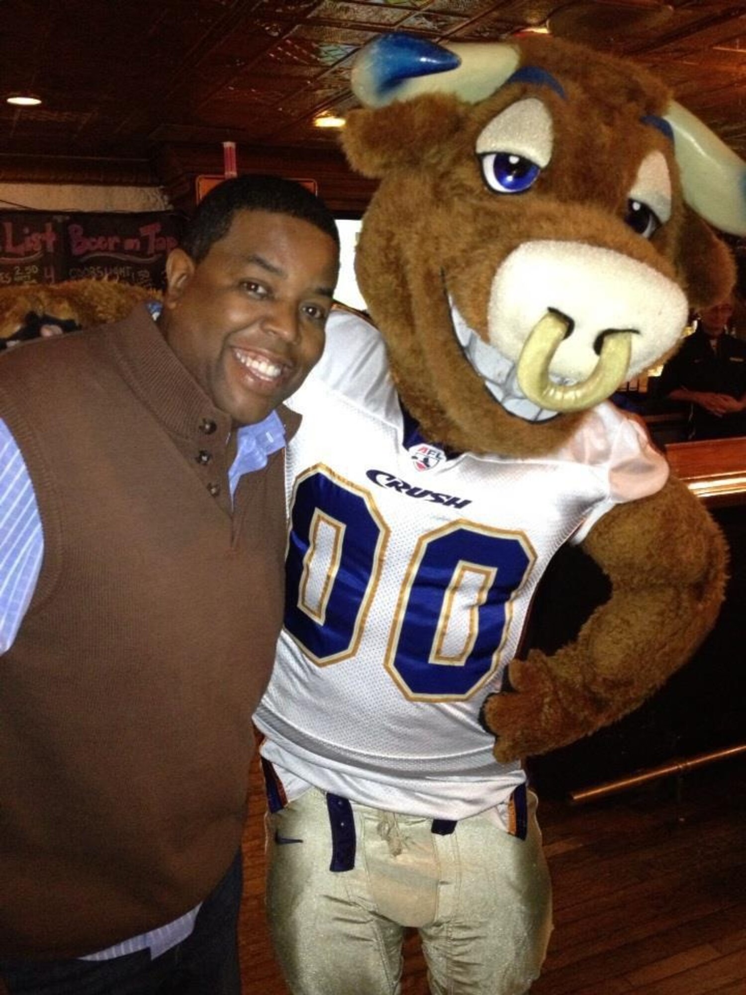 Denver Broncos Chaplain Chip Simmons, shown with Colorado Crush Arena Football League team mascot Crush, is the featured speaker at the National Prayer Luncheon 11 am March 11 at the Peterson Club ballroom. Simmons is also president of After the Game Ministries. (Courtesy photo)