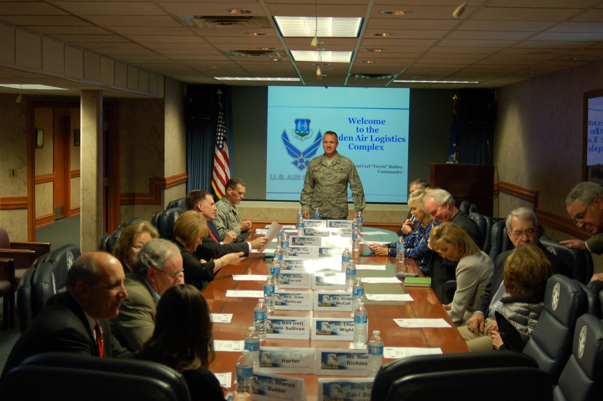 Brig. Gen. Carl A. Buhler, Ogden Air Logistics Complex commander briefs community leaders from the Utah Defense Alliance and the Top of Utah Military Affairs Committee. Attendees received a close-up look Feb. 13 at progress in F-22 Raptor maintenance here. (Air Force photo)