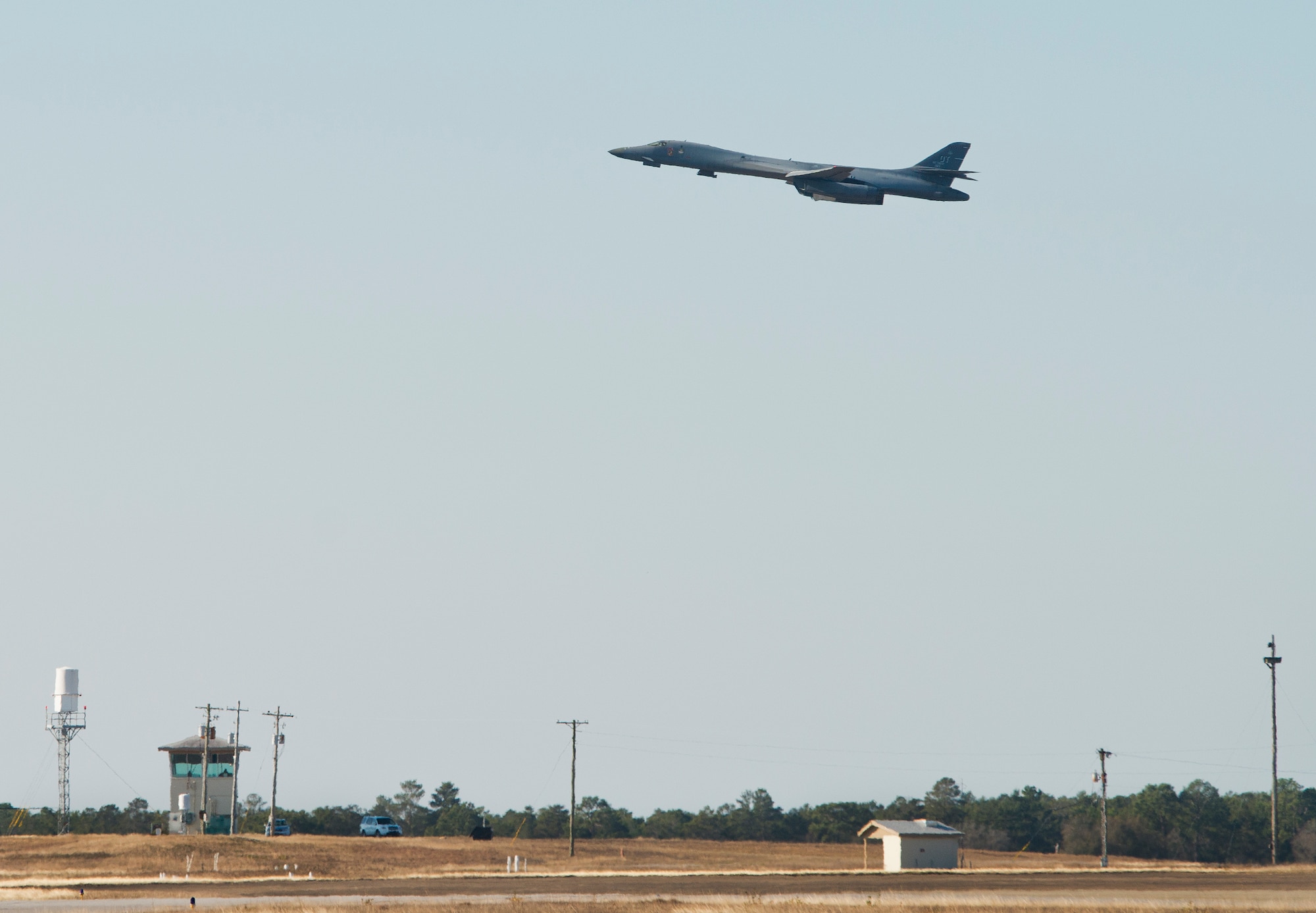 A B-1B Lancer lifts off from the Eglin Air Force Base runway Feb. 20 to return home.  The 53rd Wing bomber from Dyess AFB, Texas was here for a few missions and to allow wing personnel an opportunity to see one of their geographically separated aircraft up close. (U.S. Air Force photo/Samuel King Jr.)