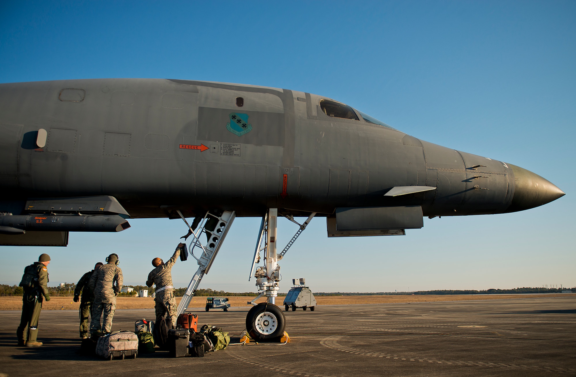 Maintainers and aircrew load up luggage onto a B-1B Lancer prior to the aircraft leaving Eglin Air Force Base, Fla. and returning to its home station Feb. 20.  The 53rd Wing bomber from Dyess AFB, Texas was here for a few missions and to allow wing personnel an opportunity to see one of their geographically separated aircraft up close. (U.S. Air Force photo/Samuel King Jr.)