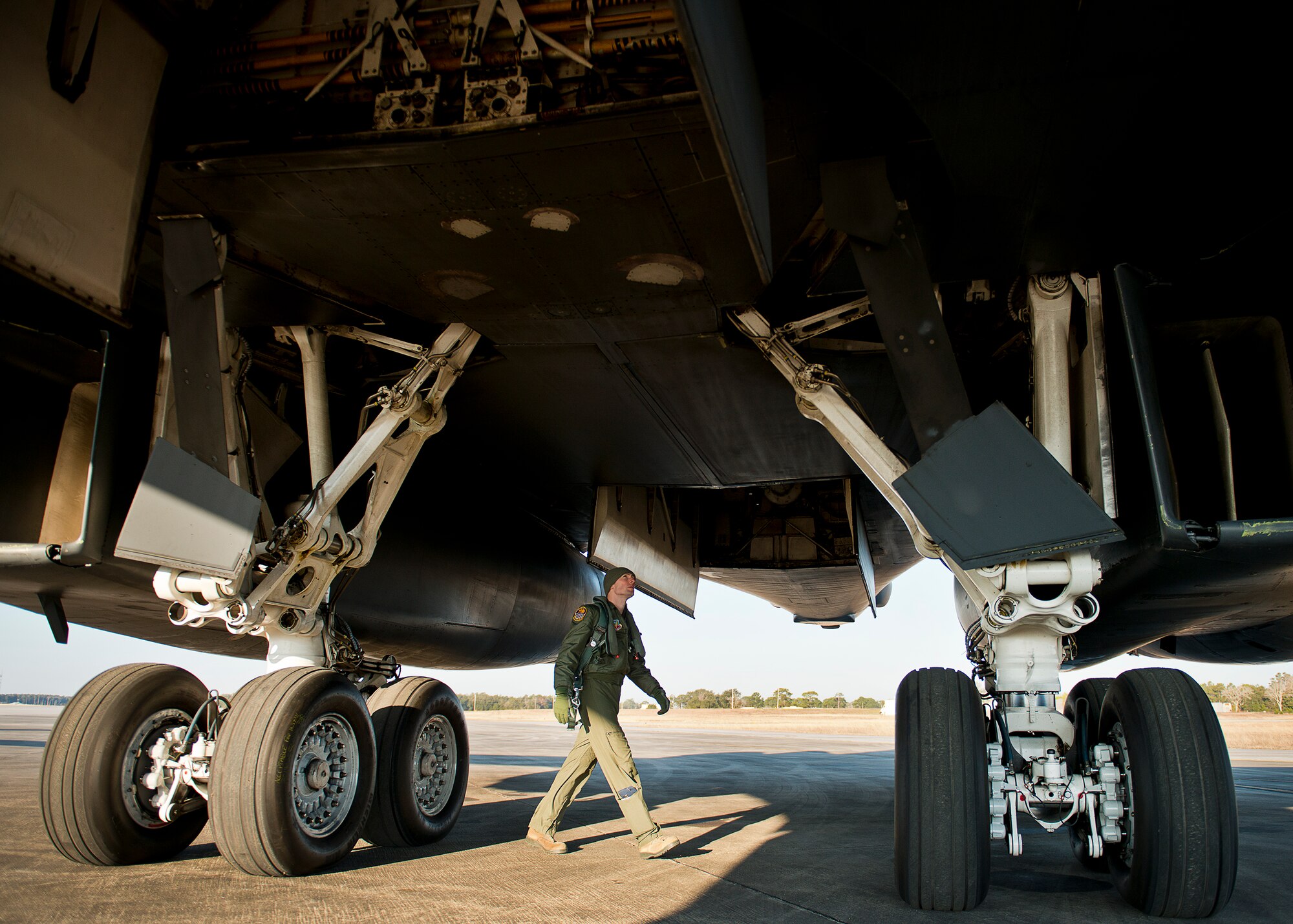 Capt. Curtis Michael, 337th Test and Evaluation Squadron, inspects underneath the B-1B Lancer during preflight checks Feb. 20 at Eglin Air Force Base, Fla.   The 53rd Wing bomber from Dyess AFB, Texas was here for a few missions and to allow wing personnel an opportunity to see one of their geographically separated aircraft up close. (U.S. Air Force photo/Samuel King Jr.)