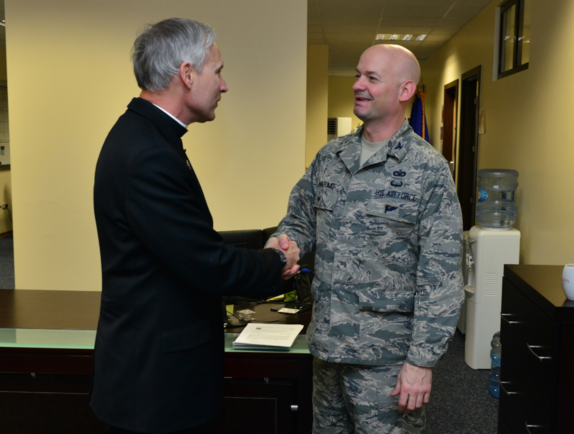 Col. Mark Anarumo, 39th Air Base Wing vice commander, greets Rev. Richard Spencer, the auxiliary bishop of the Archdiocese for the military services, U.S., during a one-day base visit Feb. 24, 2015, at Incirlik Air Base, Turkey. During his visit, Spencer conducted a confirmation Mass, met with base leadership and had a meet and greet with members of the 39th ABW chapel. (U.S. Air Force photo by Senior Airman Michael Battles/Released)