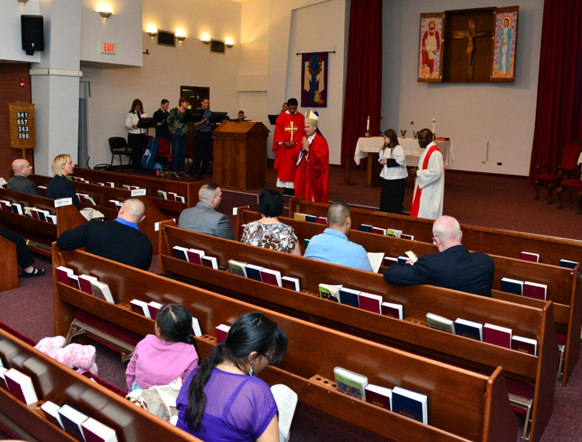 Rev. Richard Spencer, the auxiliary bishop of the Archdiocese for the military services, U.S., performs a confirmation Mass Feb. 24, 2015, at Incirlik Air Base, Turkey. Along with holding Mass, Spencer also visited Incirlik as a church relicensing official for 39th ABW’s Catholic chaplain Udechukwu. Each year, chaplains must be relicensed by the church in order to continue their ministry. (U.S. Air Force photo by Senior Airman Michael Battles/Released)