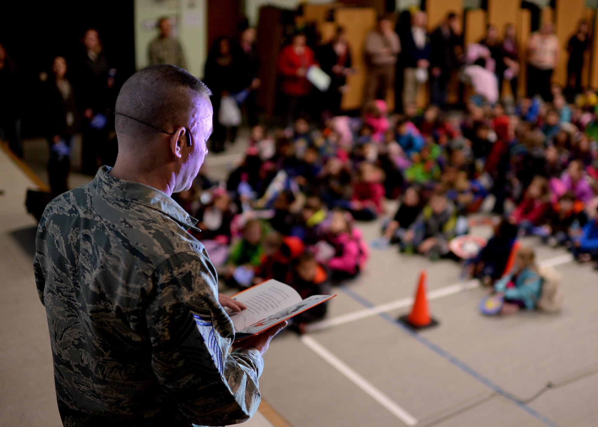 U.S. Air Force Chief Master Sgt. Brian Gates, 52nd Fighter Wing command chief, reads “Green Eggs and Ham” by children’s author Dr. Seuss during a Read Across America event March 2, 2015, in the elementary school at Spangdahlem Air Base, Germany. More than 300 children listened as the chief read the book and highlighted the importance of reading. (U.S. Air Force photo by Staff Sgt. Daryl Knee/Released)