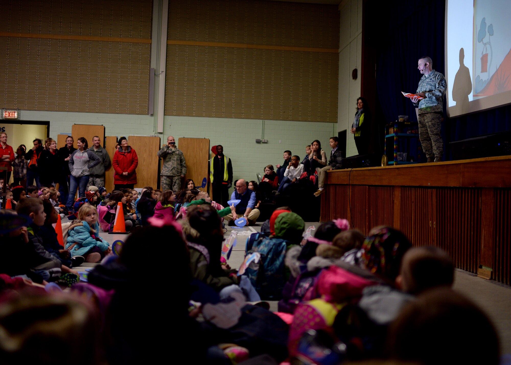 U.S. Air Force Chief Master Sgt. Brian Gates, 52nd Fighter Wing command chief, reads “Green Eggs and Ham” by children’s author Dr. Seuss during a Read Across America event March 2, 2015, in the elementary school at Spangdahlem Air Base, Germany. Department of Defense Education Activity schools across the world paused March 2 to celebrate the importance of reading. (U.S. Air Force photo by Staff Sgt. Daryl Knee/Released)