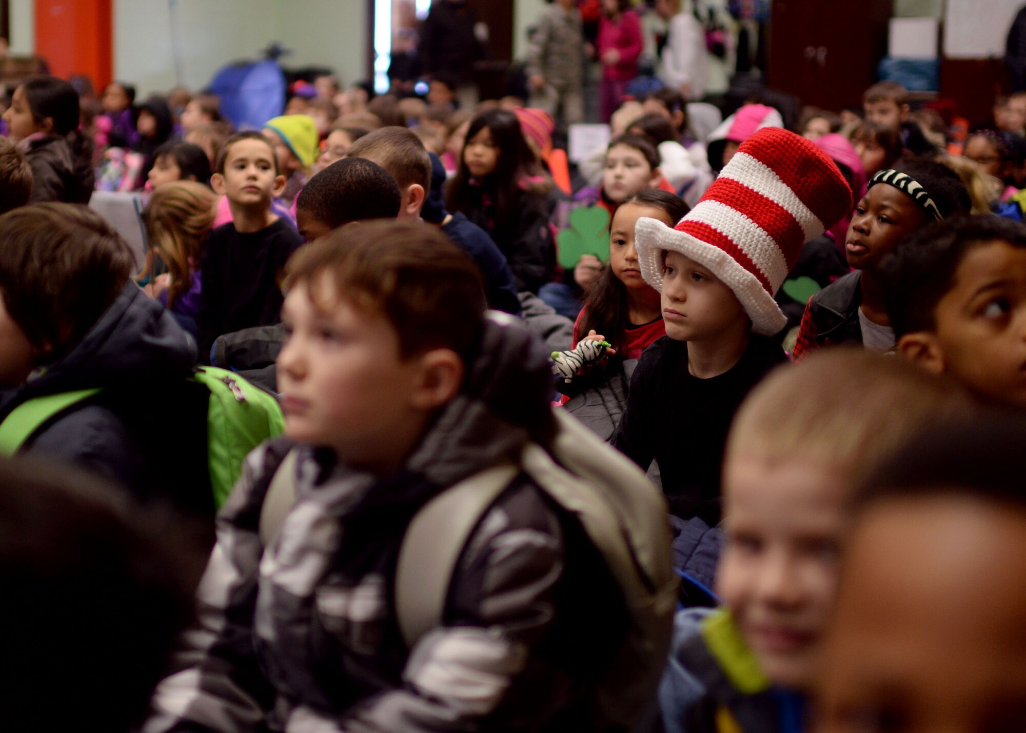 Logan Dozier, a second-grade student at Spangdahlem Elementary School, sports a striped top hat during a morning assembly March 2, 2015, at Spangdahlem Air Base, Germany. The school gathered the students in support of Read Across America, which is observed through the Department of Defense Education Activity in overseas locations. The day honors the importance of reading and coincides with the birth of children’s author Dr. Seuss. (U.S. Air Force photo by Staff Sgt. Daryl Knee/Released)