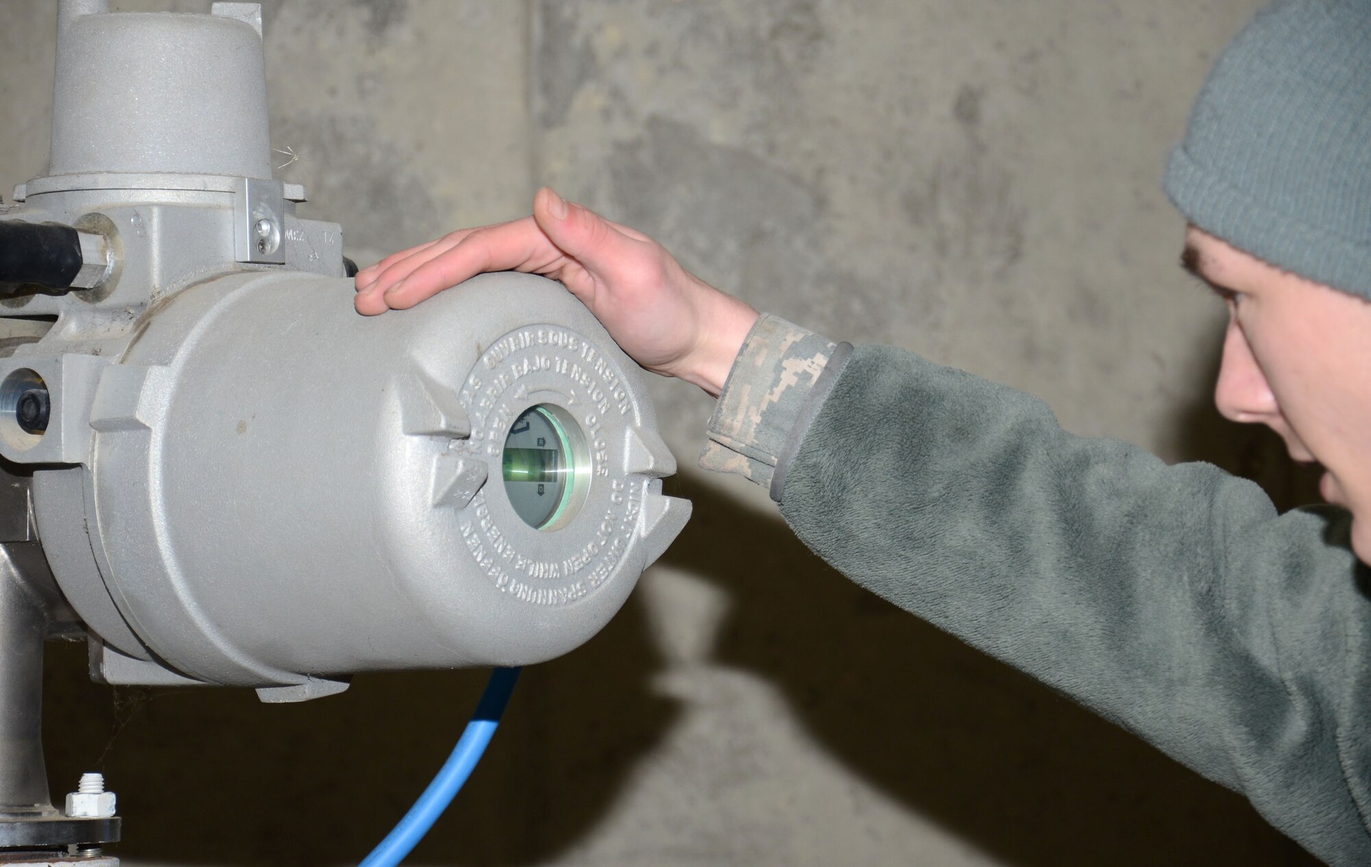 U.S. Air Force Airman 1st Class Daniel Lingefelt, 100th Logistics Readiness Squadron Fuels fixed facilities journeyman from Pendleton, S.C., checks an Enraf Vito Probe (water sensing equipment) Feb. 11, 2015, on RAF Mildenhall, England. Lingefelt ensures there is no water present in the fuel tank. (U.S. Air Force photo by Gina Randall/Released)