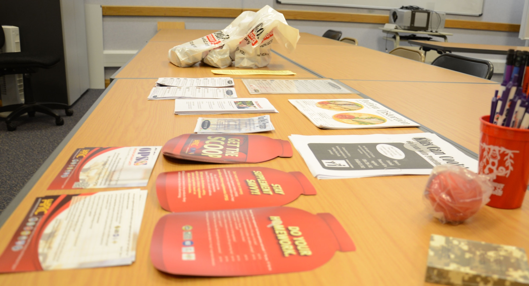 Informational material is displayed for participants during an Italian cooking demonstration Feb. 26, 2015, in the Hardstand Fitness Center on RAF Mildenhall, England. Each month, the 100th Force Support Squadron Hardstand Fitness Center staff hosts a free cooking class to teach base members how to cook healthy meals. (U.S. Air Force photo by Gina Randall/Released)