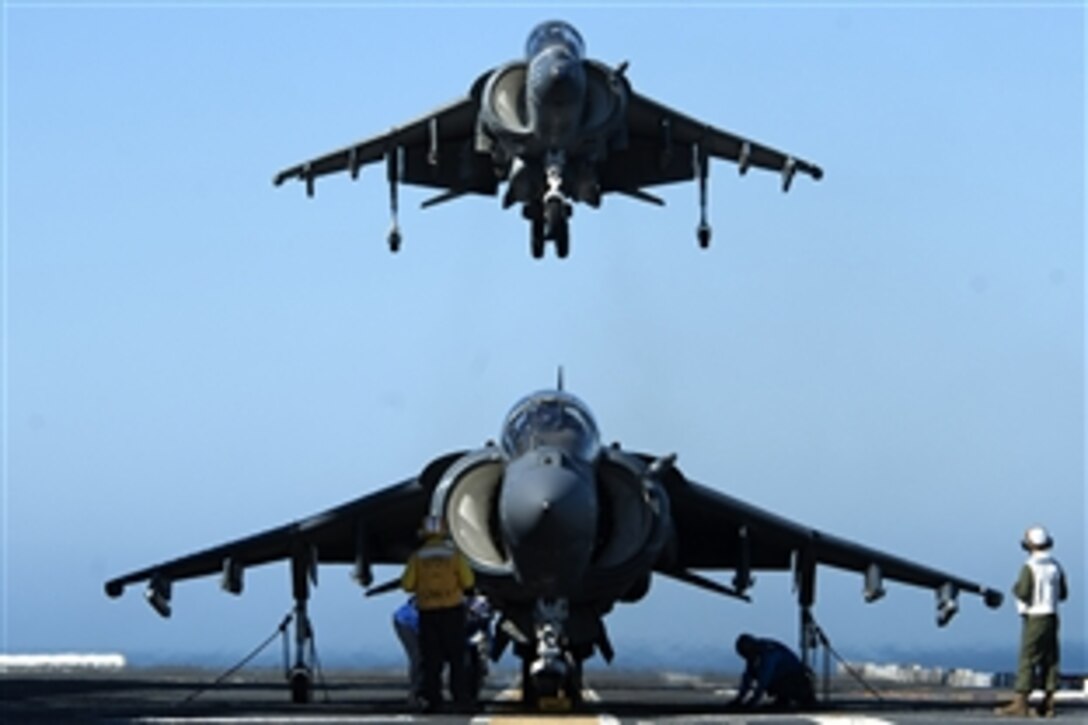 An AV-8B Harrier prepares to land on the flight deck of the amphibious assault ship USS America during training operations in the Pacific Ocean, Feb. 25, 2015. The aircraft is assigned to Marine Attack Squadron 311.