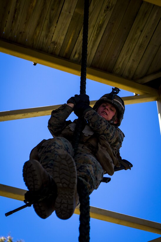 U.S. Marine Corps Lance Cpl. Russell Blackledge, a rifleman with Special-Purpose Marine Air-Ground Task Force Crisis Response-Africa, fast ropes down a tower during a fast-rope qualification on Rota Naval Base, Spain, Feb. 25, 2015. Marines maintain their skills in order to be able to rappel out of an MV-22 Osprey in support of future operations. (U.S. Marine Corps photograph by Lance Cpl. Christopher Mendoza/Released)