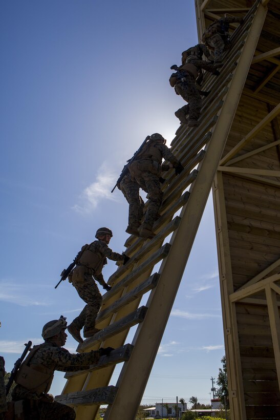 U.S. Marines with Special-Purpose Marine Air-Ground Task Force Crisis Response-Africa ascend a rappel tower on Rota Naval Base, Spain, Feb. 25, 2015. The ability to fast rope out of MV-22 Ospreys allows the Marines to insert into difficult terrain in the event of a crisis response situation. (U.S. Marine Corps photograph by Lance Cpl. Christopher Mendoza/Released)