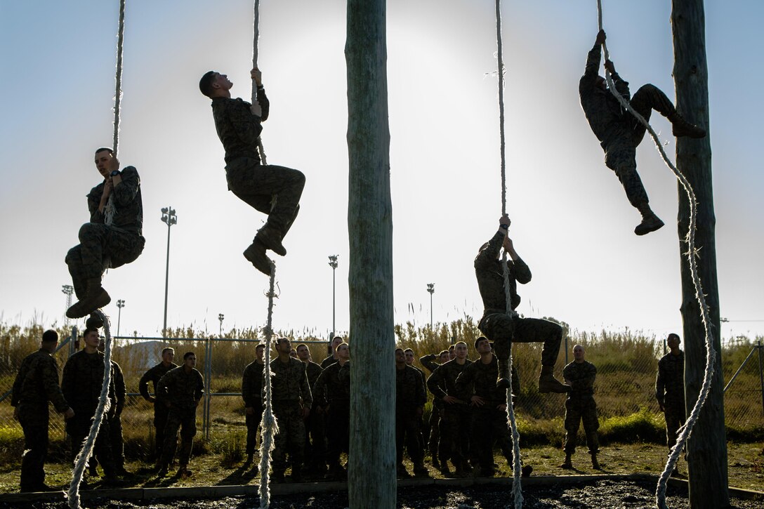 U.S. Marines with Special-Purpose Marine Air-Ground Task Force Crisis Response-Africa ascend ropes during an obstacle course on Rota Naval Base, Spain, Feb. 26, 2015. The course tested the Marines’ physical readiness with a series of demanding obstacles designed to simulate the challenges of a combat environment. (U.S. Marine Corps photograph by Lance Cpl. Christopher Mendoza/Released)