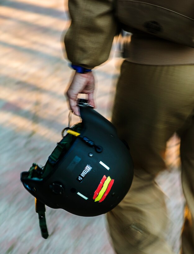 Spanish Capt. Alvaro Esteban, a pilot with Bhelma IV, carries his flight helmet before night training with U.S. Marine Corps MV-22B Osprey pilots from Special-Purpose Marine Air-Ground Task Force Crisis Response-Africa, at an airfield near Morón Air Base, Spain, Feb. 24, 2015. Esteban flew his Spanish helicopter in formation with the Marines’ tiltrotor Osprey, which completed several simultaneous night landings alongside the Spanish aircraft. (U.S. Marine Corps photo by Sgt. Paul Peterson/Released)