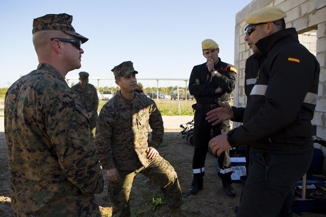 U.S. Marine Corps explosive ordnance disposal technicians with Special-Purpose Marine Air-Ground Task Force Crisis Response-Africa discuss their various mission capabilities and future joint training opportunities with the Spanish Defense Force’s Unidad Militar de Emergencias, an emergency response unit, at Morón Air Base, Spain, Feb. 18, 2015. Joint training provides the Marines and Spanish forces opportunities to further their capabilities by cross training and learning to operate as a cohesive team. (U.S. Marine Corps photograph by Lance Cpl. Christopher Mendoza/Released)