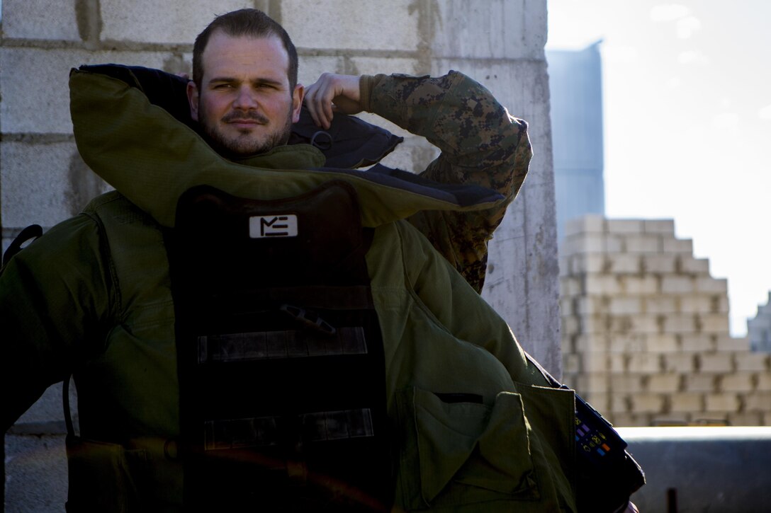 Spanish Defense Force Cabo Primero Antonio Diosdade, a noncommissioned officer with Unidad Militar de Emergencias, an emergency response force, puts on a bomb suit at Morón Air Base, Spain, Feb. 18, 2015. Explosive ordnance disposal Marines with Special-Purpose Marine Air-Ground Task Force Crisis Response-Africa, which is based out of Morón, demonstrate the different capabilities of their equipment to further develop the two units’ relationship for future NATO training events. (U.S. Marine Corps photograph by Lance Cpl. Christopher Mendoza/Released)