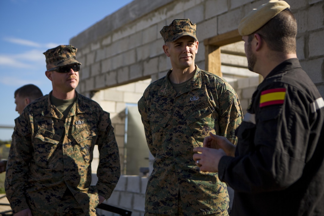 U.S. Marine Corps Warrant Officer Ahbleza Theobald, center, an explosive ordnance disposal technician with Special-Purpose Marine Air-Ground Task Force Crisis Response-Africa, discusses future joint training opportunities with Cabo Primero Antonio Diosdado, right, a Spanish Defense Force public affairs representative with Unidad Militar de Emergencias, an emergency response force, at Morón Air Base, Spain, Feb. 18., 2015. Bi-lateral training exercises between the partner nations provide unique opportunities for the service members to learn from each other and develop the ability to operate as a cohesive team. (U.S. Marine Corps photograph by Lance Cpl. Christopher Mendoza/Released)