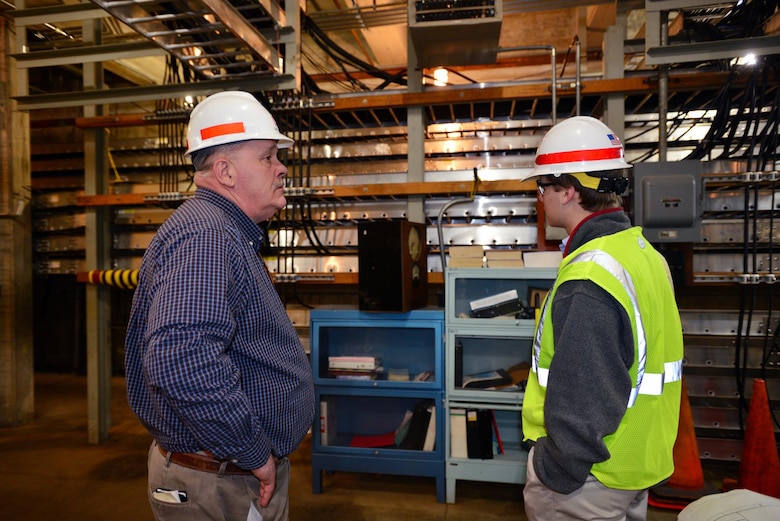Jeff Flowers, Mid Cumberland Power Project manager gives Michael Lee a sophomore student from Montgomery Bell Academy a tour of the Center Hill Dam power house spread room.  Lee participated in an engineer shadow program with the U.S. Army Corps of Engineers Nashville District Engineering-Construction Branch Feb. 27, 2015.