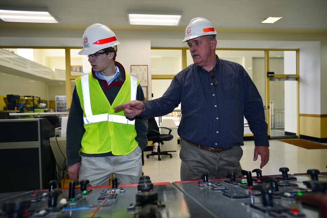 Jeff Flowers, Mid-Cumberland Power Project manager gives Michael Lee, a sophomore student from Montgomery Bell Academy a tour of the Center Hill Dam power house control room.  Lee participated in an engineer shadow program with the U.S. Army Corps of Engineers Nashville District Engineering-Construction Branch Feb. 27, 2015.