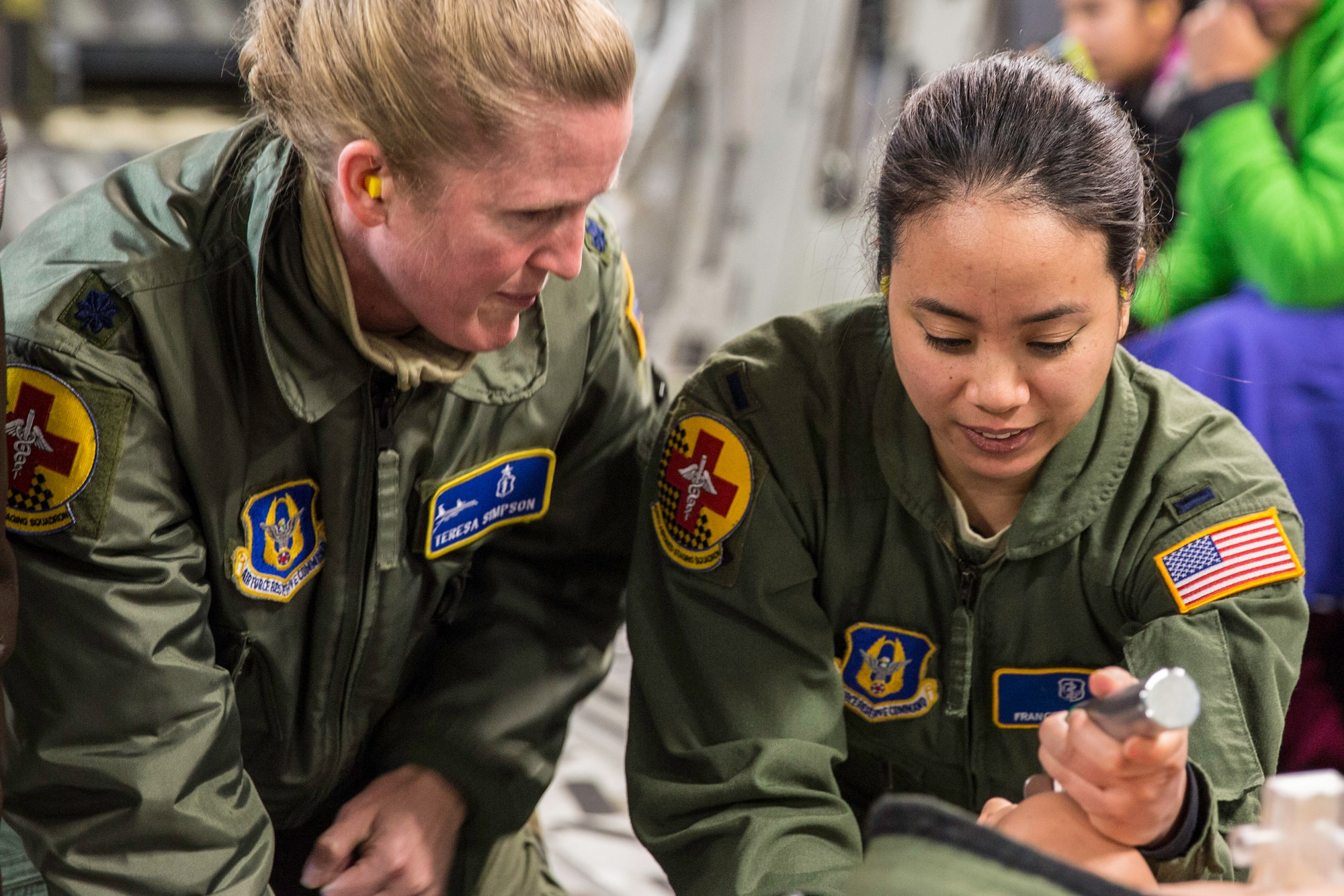 Lt. Col. Teresa Simpson watches 1st Lt. Frances Santiago practice her intubation technique on a mannequin Feb. 21, 2015 during a training mission in San Juan, Puerto Rico. The training mission was part of a three day fly-away with Airmen from the 315th Airlift Wing at Joint Base Charleston, South Carolina and aeromedical Airmen from the 459th Air Refueling Wing at Joint Base Andrews, Maryland. The training mission was a cost-effective means to accomplish currency items and evaluations for flight crew members and provided C-17 familiarization and proficiency training for aeromedical Airmen. Simpson is a critical care physician and Santiago is a critical care nurse. Both are assigned to the 459th Aeromedical Staging Squadron. (U.S. Air Force Photo/Tech. Sgt. Shane Ellis)
