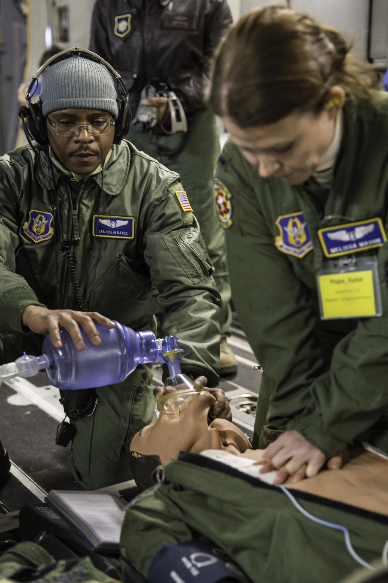 Senior Airman Colin Hayes and 1st Lt. Melissa Mason perform CPR on a mannequin Feb. 21, 2015 during a training mission in San Juan, Puerto Rico. The mission was part of a three day fly-away with Airmen from the 315th Airlift Wing at Joint Base Charleston, South Carolina and aeromedical Airmen from the 459th Air Refueling Wing at Joint Base Andrews, Maryland. The training mission was a cost-effective means to accomplish currency items and evaluations for flight crew members and provided C-17 familiarization and proficiency training for aeromedical Airmen. Hayes is an aeromedical technician and Mason is a flight nurse. Both are assigned to the 459th Aeromedical Evacuation Squadron. (U.S. Air Force Photo/Tech. Sgt. Shane Ellis)
