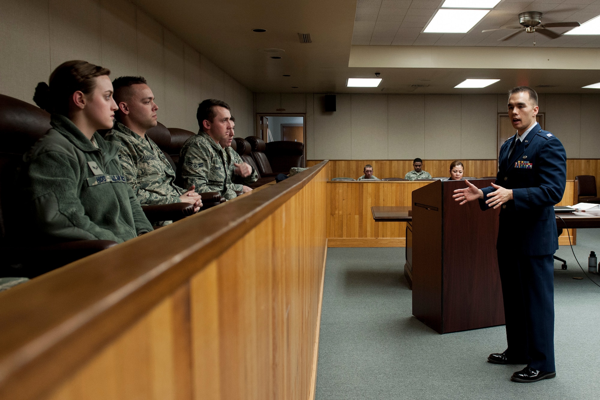 Capt. Brian Adams speaks to Airmen during a sexual assault mock trial Feb. 24, 2015, at Kunsan Air Base, South Korea. In an attempt to highlight the emotional, legal and wide-reaching ramifications of sexual assault in the U.S. armed forces, the 8th Fighter Wing Sexual Assault and Prevention and Response Office teams up with the base legal office to conduct mock trials once a month for every first-term Airman entering Kunsan. Adams is the 8th FW deputy staff judge advocate. (U.S. Air Force photo/ Senior Airman Katrina Heikkinen)