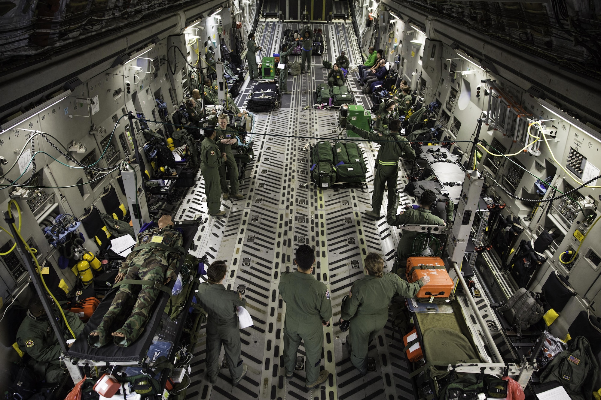 Reservists assigned to the 459th Air Refueling Wing at Joint Base Andrews, Md. conduct aeromedical training in a C-17 Globemaster III Feb. 22, 2015 during a training mission in San Juan, Puerto Rico. The mission was part of a three day fly-away with Airmen from the 315th Airlift Wing at Joint Base Charleston, South Carolina and aeromedical Airmen from the 459th Air Refueling Wing at Joint Base Andrews, Maryland. The training mission was a cost-effective means to accomplish currency items and evaluations for flight crew members and provided C-17 familiarization and proficiency training for aeromedical Airmen. (U.S. Air Force Photo/Tech. Sgt. Shane Ellis)
