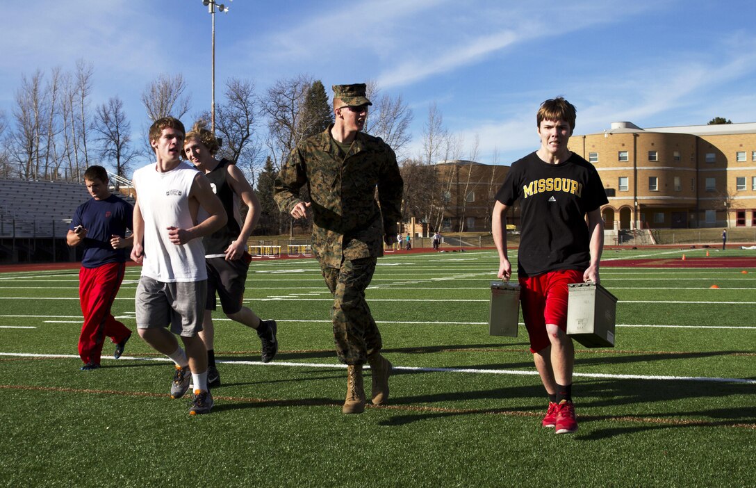 Students from Logan High School in Logan, Utah, participate in a Marine Corps Combat Fitness test Feb. 11, 2015, as part of their strength and conditioning with the athletics department. The students and coaches used this opportunity to learn more about the Marine Corps and what it takes physically to be a Marine.(U.S. Marine Corps Photo by Sgt. Daniel Wetzel)
