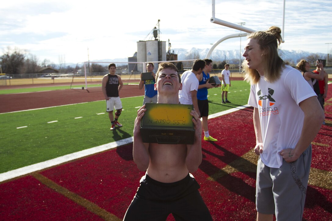 Students from Logan High School in Logan, Utah, participate in a Marine Corps Combat Fitness test Feb. 11, 2015, as part of their strength and conditioning with the athletics department. The students and coaches used this opportunity to learn more about the Marine Corps and what it takes physically to be a Marine.(U.S. Marine Corps Photo by Sgt. Daniel Wetzel)