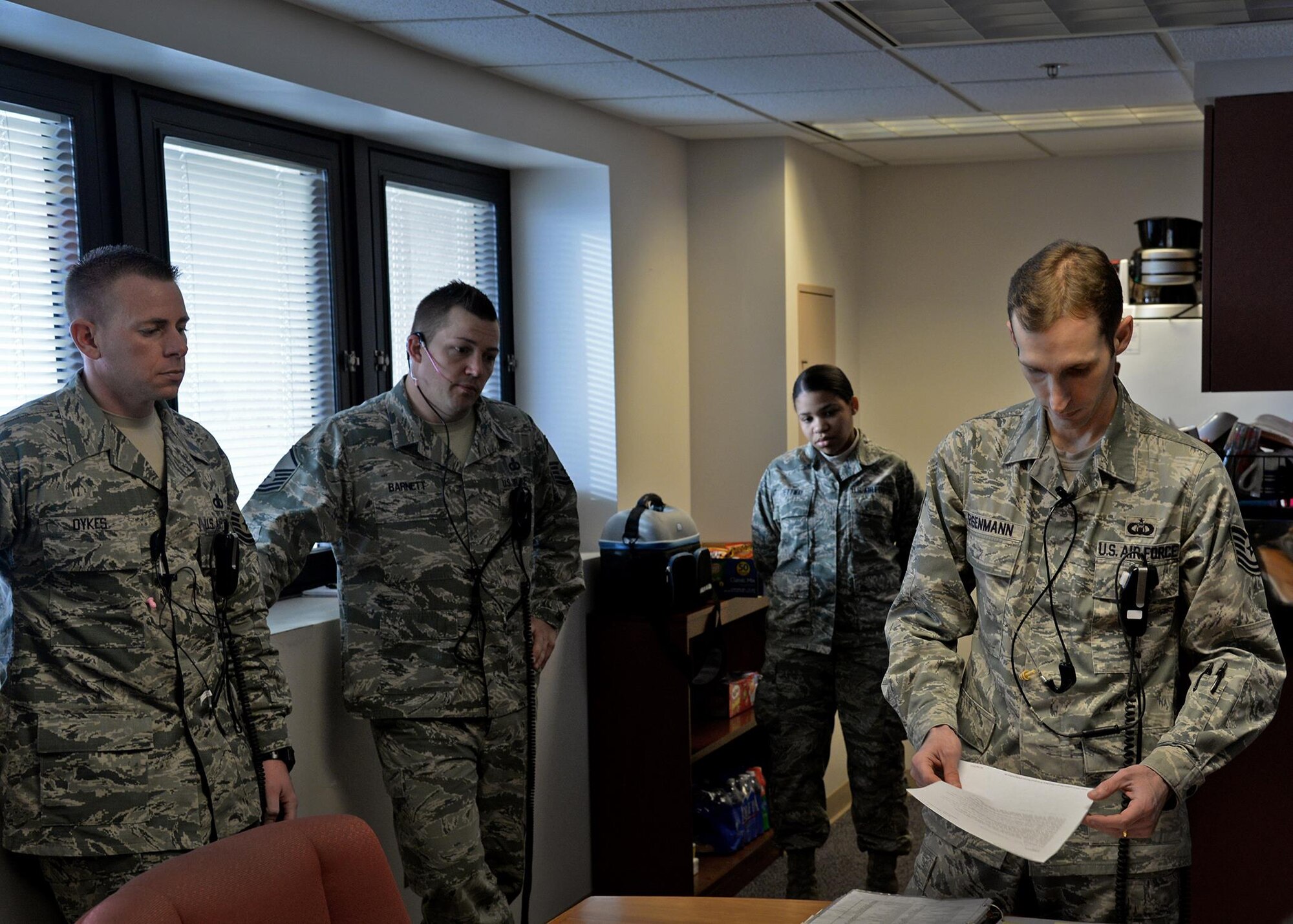 Members of the 27th Special Operations Support Squadron air traffic control conduct a morning brief detailing the schedule of the day and duties of the controllers Feb. 24, 2015 at Cannon Air Force Base, N.M. The Air Commandos of the 27th SOSS ensured that 2014 was the safest year in aviation. (U.S. Air Force photo/Airman 1st Class Chip Slack)