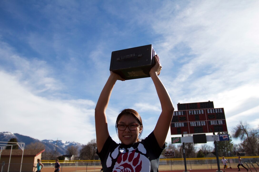 Students from Logan High School in Logan, Utah, participate in a Marine Corps Combat Fitness test Feb. 11, 2015, as part of their strength and conditioning with the athletics department. The students and coaches used this opportunity to learn more about the Marine Corps and what it takes physically to be a Marine. (U.S. Marine Corps Photo by Sgt. Daniel Wetzel)