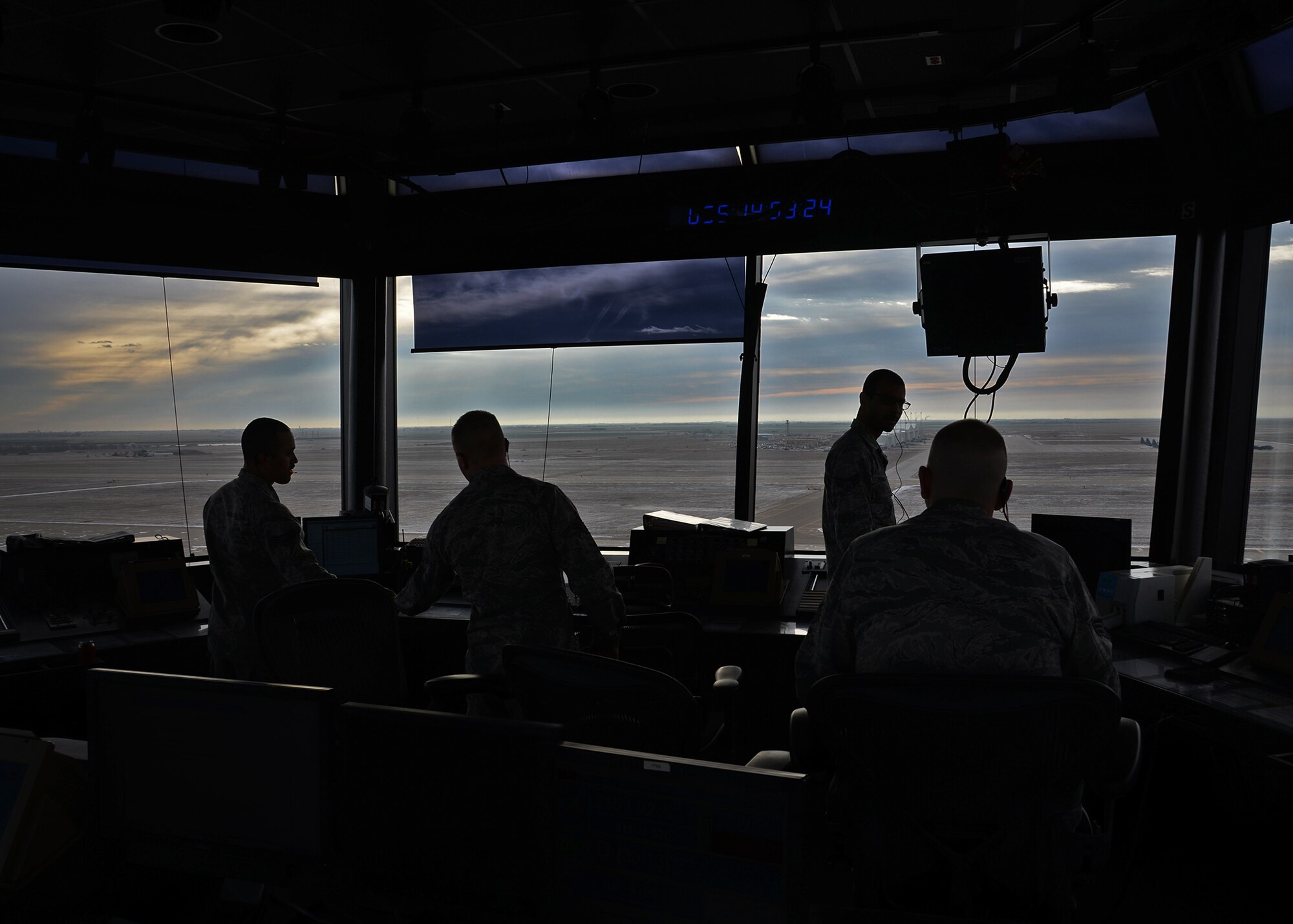Members of the 27th Special Operations Support Squadron air traffic control prep their stations in the tower and start a new day of monitoring the airspace Feb. 24, 2015 at Cannon Air Force Base, N.M. Air traffic control is split into two distinct sections: the tower and Radar Approach Control; both of which are essential in monitoring the air spaces surrounding Cannon. (U.S. Air Force photo/Airman 1st Class Chip Slack)